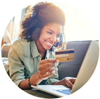 smiling woman holding her credit card