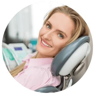smiling woman relaxing in a dental chair