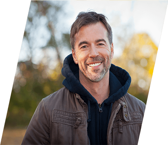 Man smiling after getting dentures in Corvallis