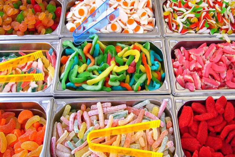 Colorful divided trays of different types of candy