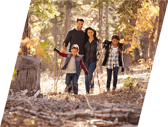 family walking on a trail