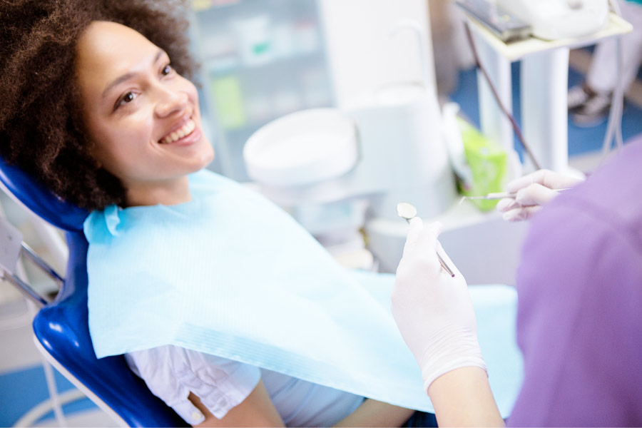 Smiling woman in the dental chair.