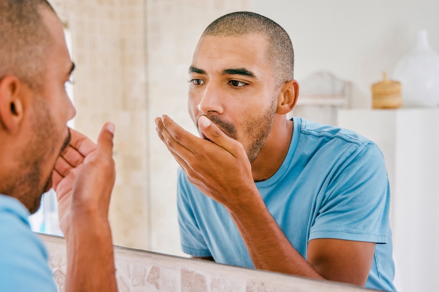 man with bad breath seeking halitosis treatment in Corvallis, OR