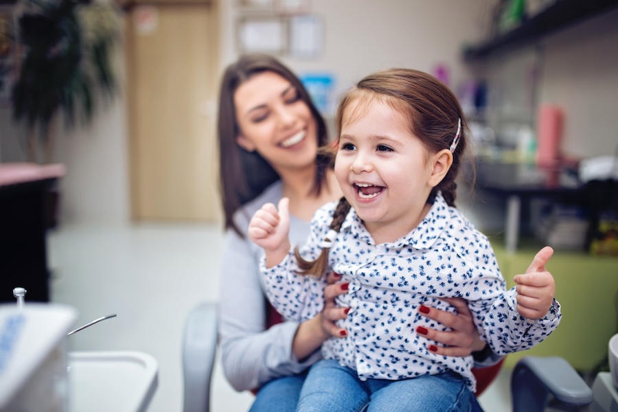 child at dentist for pediatric dental cleanings